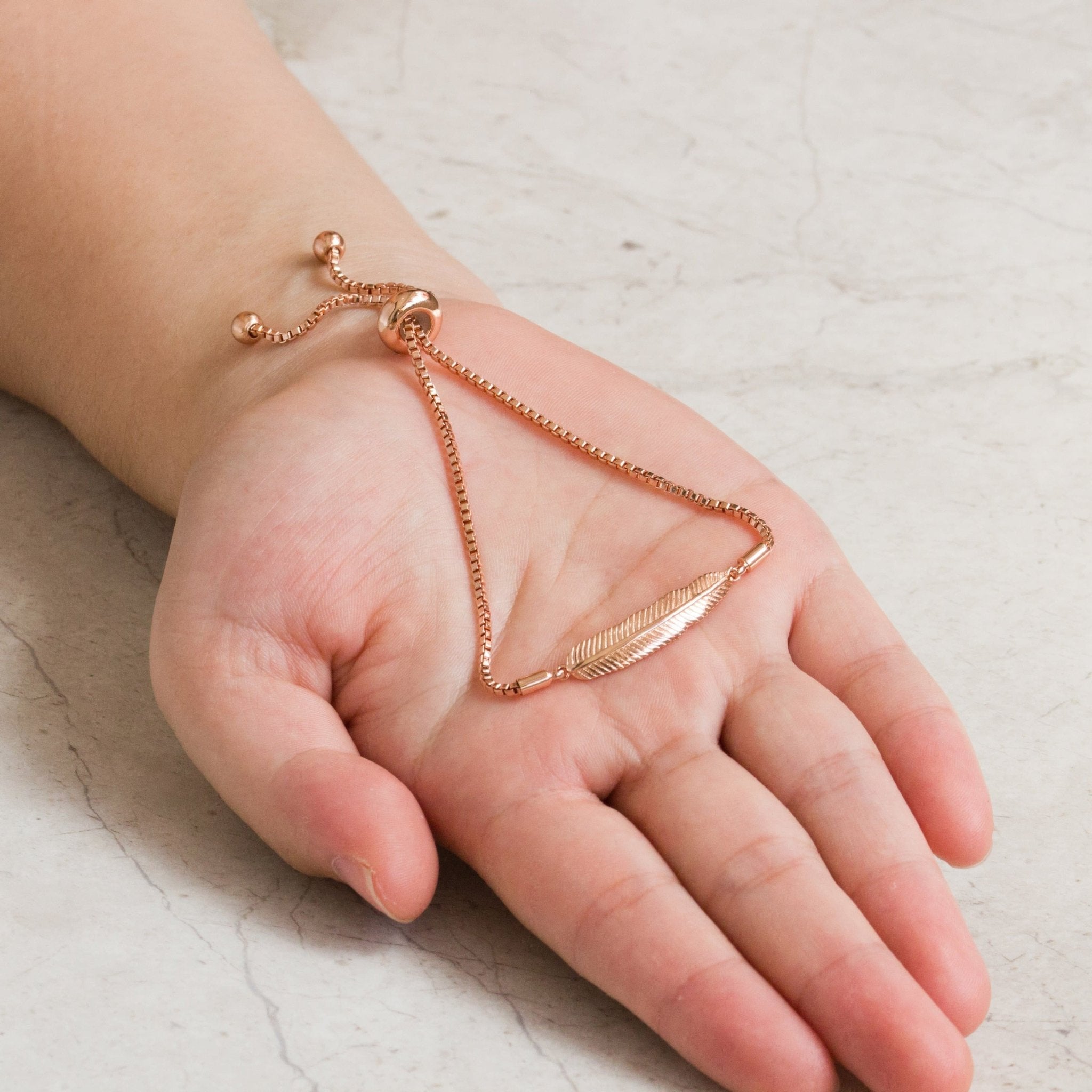 Rose Gold Plated Feather Friendship Slider Bracelet Created with Zircondia® Crystals
