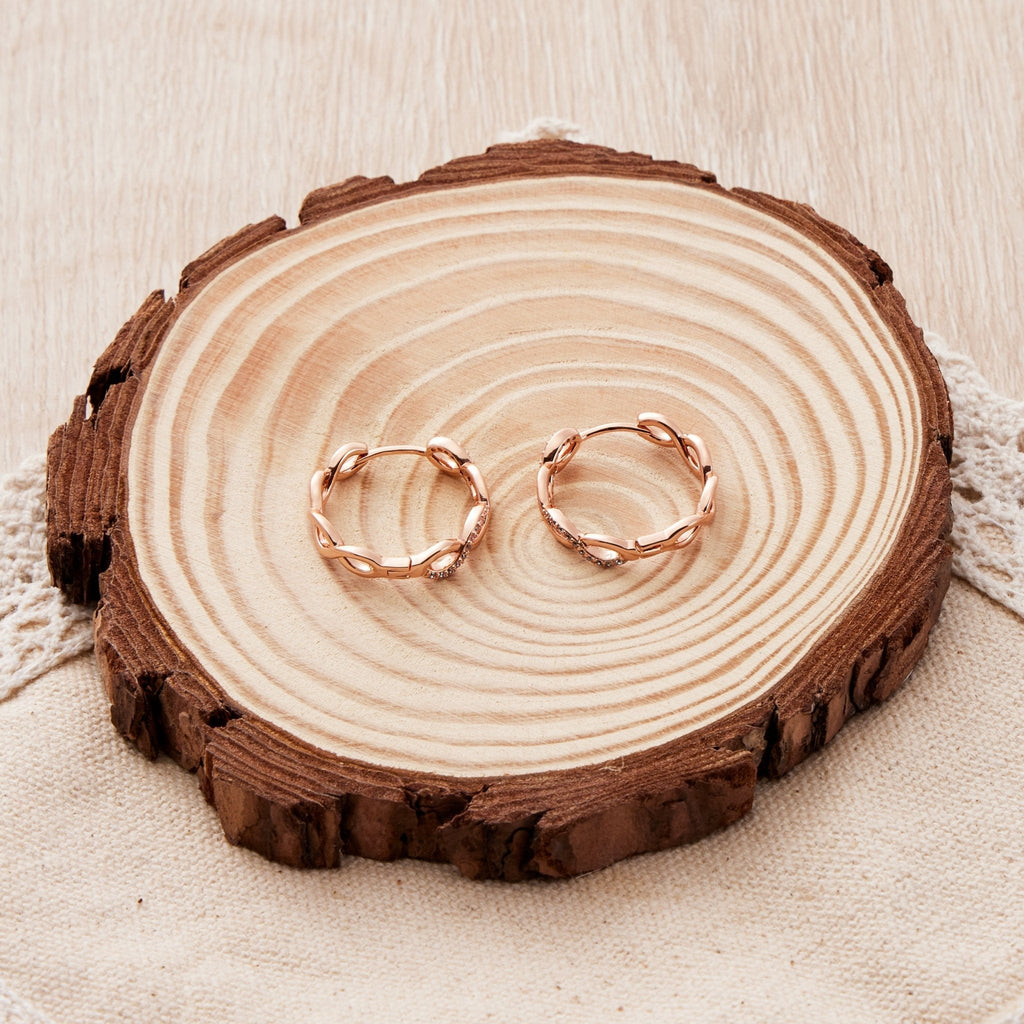 Rose Gold Plated Infinity Hoop Earrings Created with Zircondia® Crystals