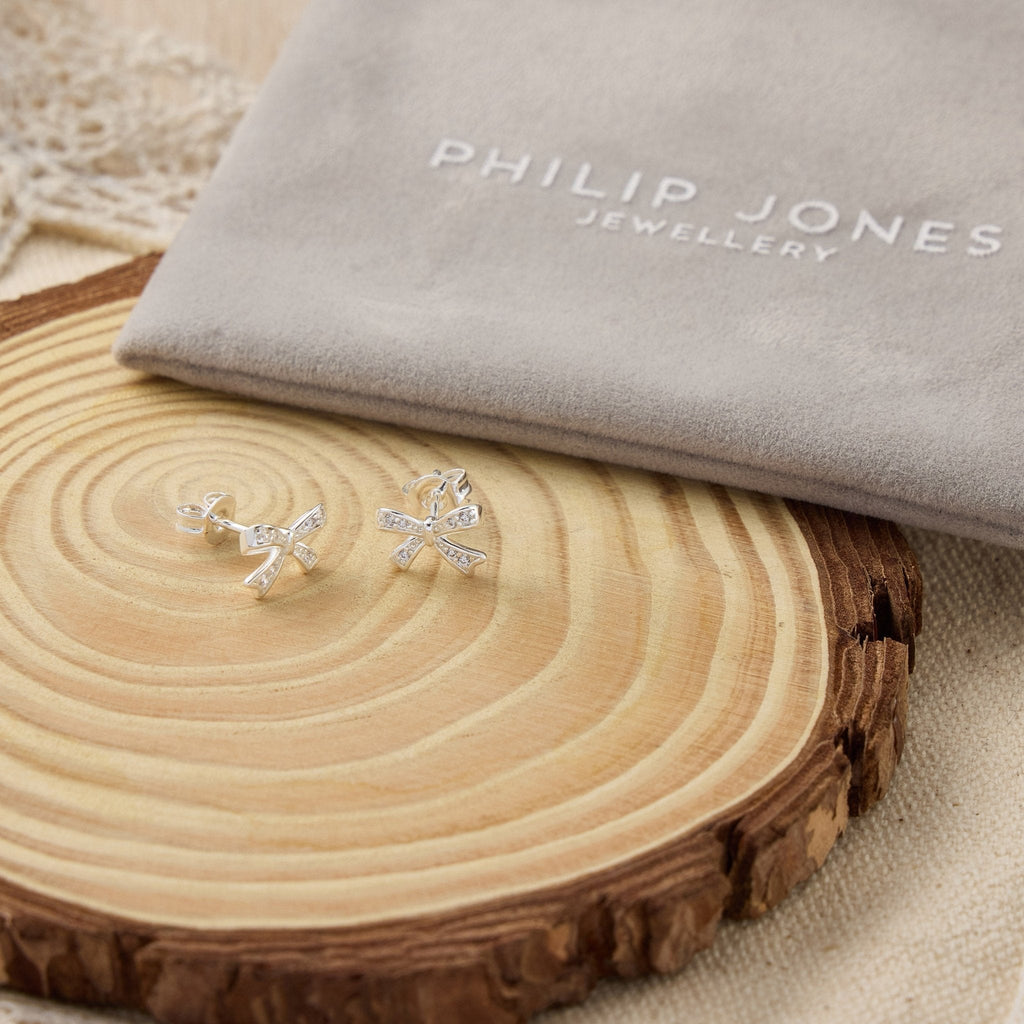 Silver Plated Bow Earrings Created with Zircondia® Crystals