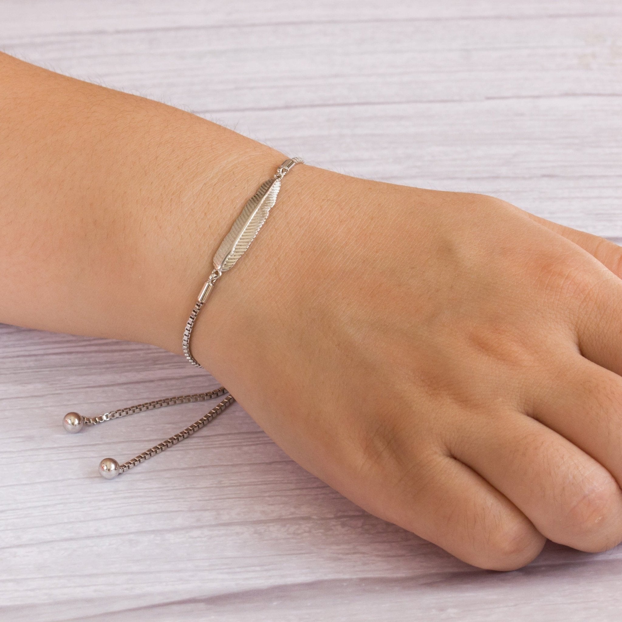 Silver Plated Feather Friendship Slider Bracelet Created with Zircondia® Crystals