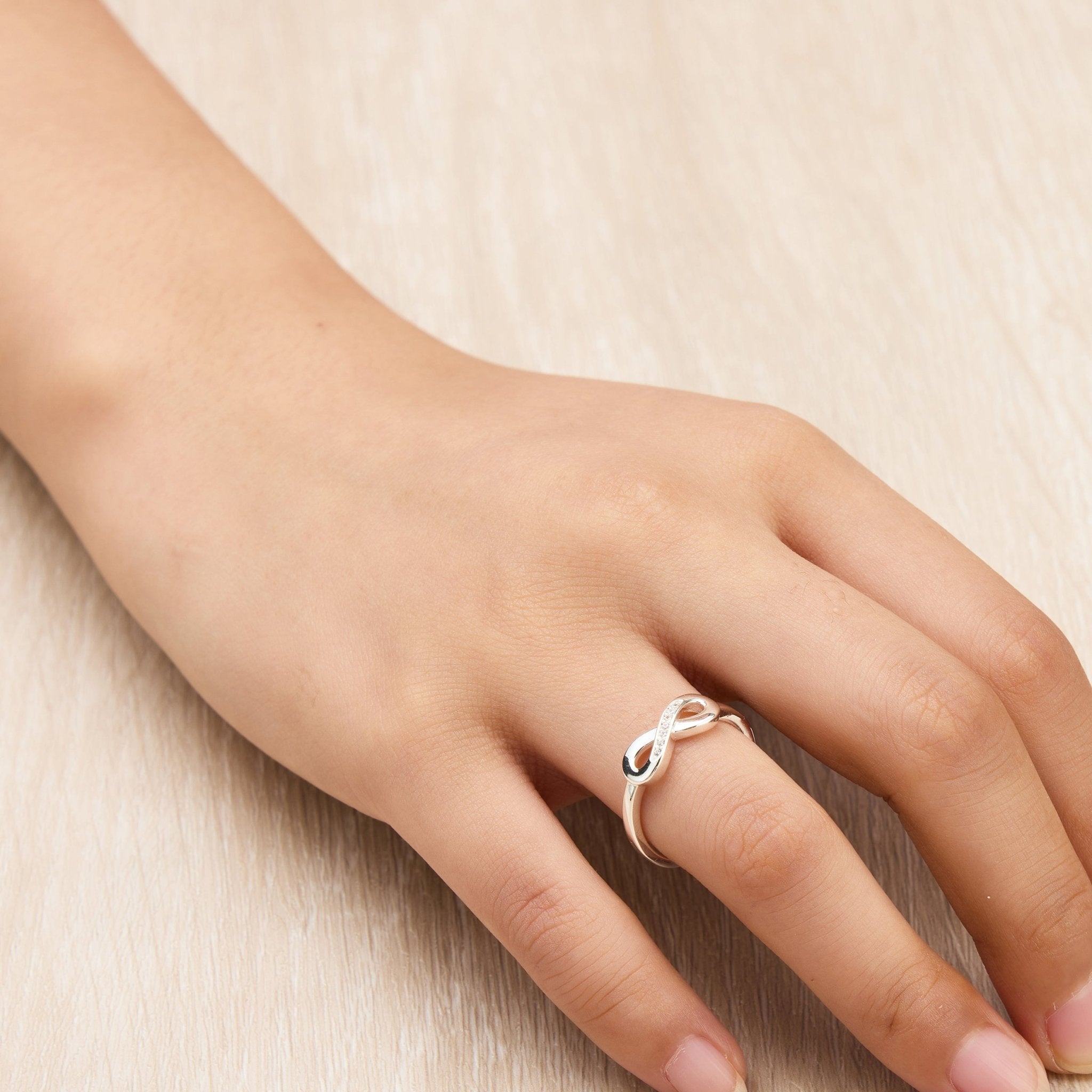 Silver Plated Adjustable Infinity Ring Created with Zircondia® Crystals