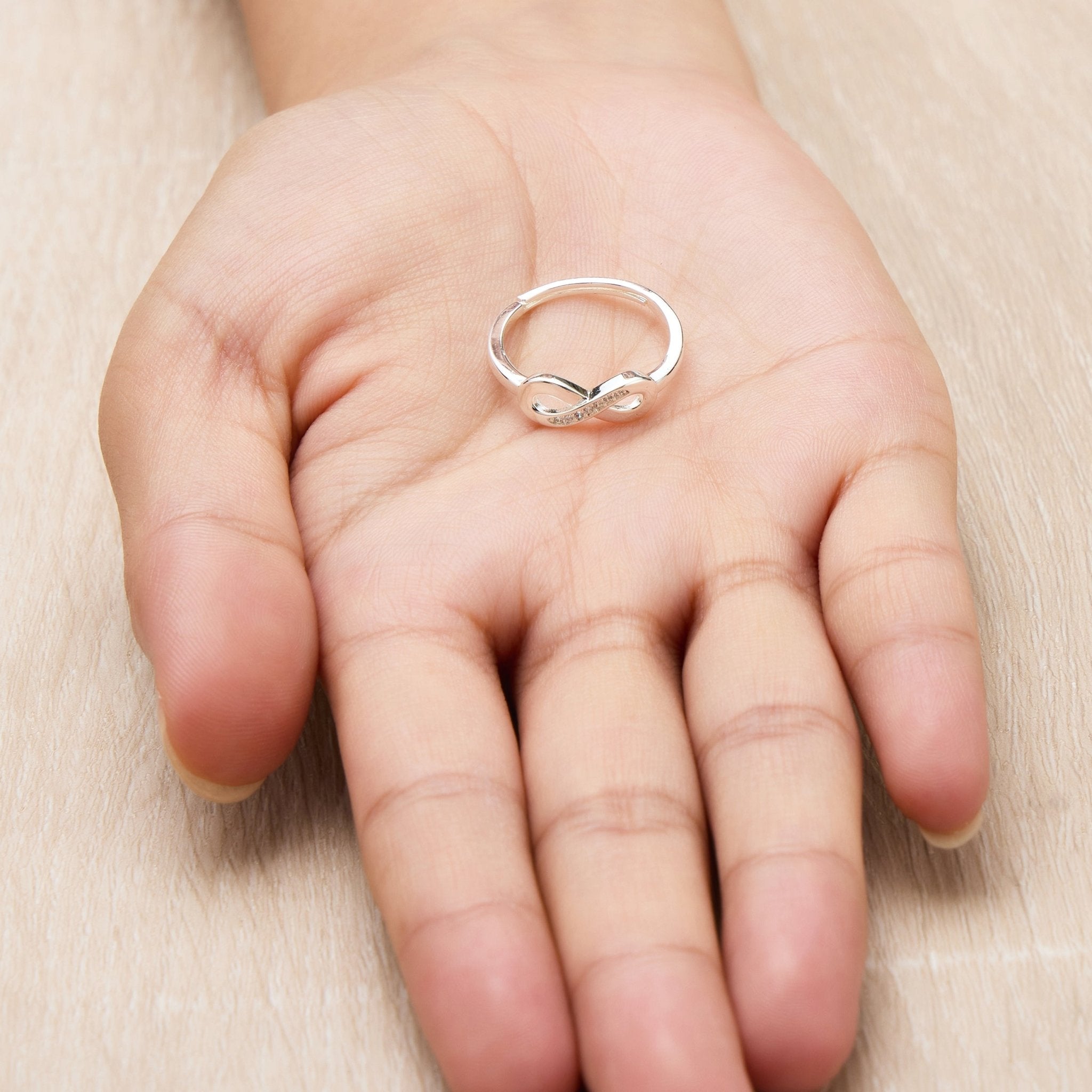 Silver Plated Adjustable Infinity Ring Created with Zircondia® Crystals